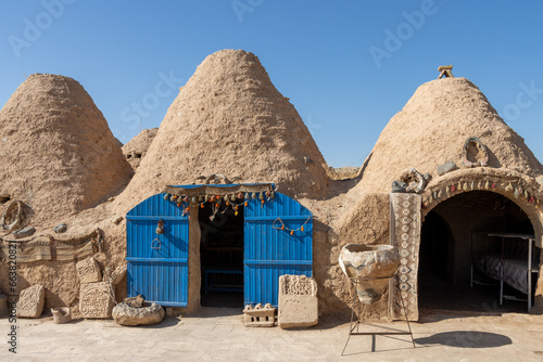 A beehive or tomb house is a building made from a circle of stones and mud topped with a domed roof. The name comes from the similarity in shape to a straw beehive. photo