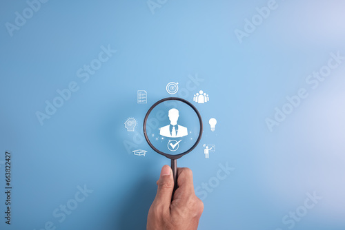 HR hiring recruit job.searching job and business leadership concept.hand holding magnifier with person icon.