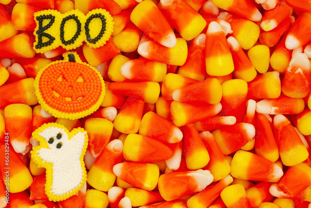 Candy corn, ghost, pumpkin, and boo Halloween background Stock 写真 Adobe Stock