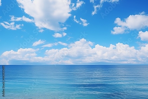 Azure Panorama: White Clouds Drifting Over Turquoise Ocean and Blue Sky © pierre