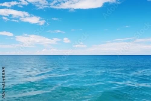 Azure Panorama: White Clouds Drifting Over Turquoise Ocean and Blue Sky