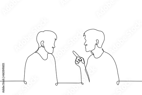 man, frowning his eyebrows, points with index finger at a man sitting next to him and looking at - one line art vector. concept accusations, moralizing, instructions, claims