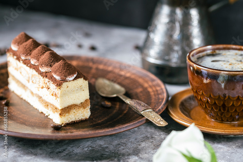 Italian dessert tiramisu close-up. Low key 