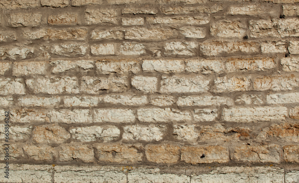 An ancient wall made of gray old bricks in Tallinn. Texture An ancient wall made of gray old bricks in Tallinn. Texture