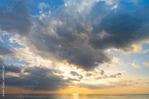 Landscape colorful clouds in the sky sunset or sunrise over sea with reflection in the tropical sea Beautiful landscape scenery Amazing light of nature  Landscape nature background