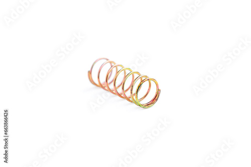 Golden helical coil spring isolated on white background, Old coil spring