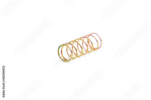 Golden helical coil spring isolated on white background, Old coil spring