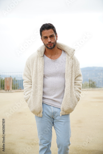 Handsome man in his thirties wearing a woolen jacket          