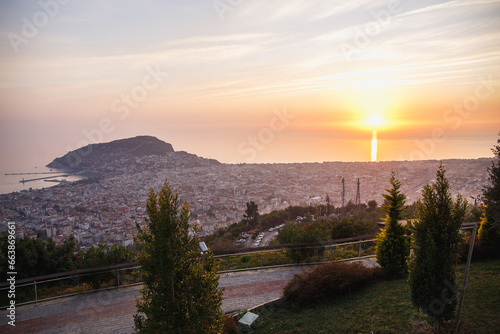 Fototapeta Naklejka Na Ścianę i Meble -  View from the mountains on Alanya, Turkey. Cityscape with sunset over the sea.