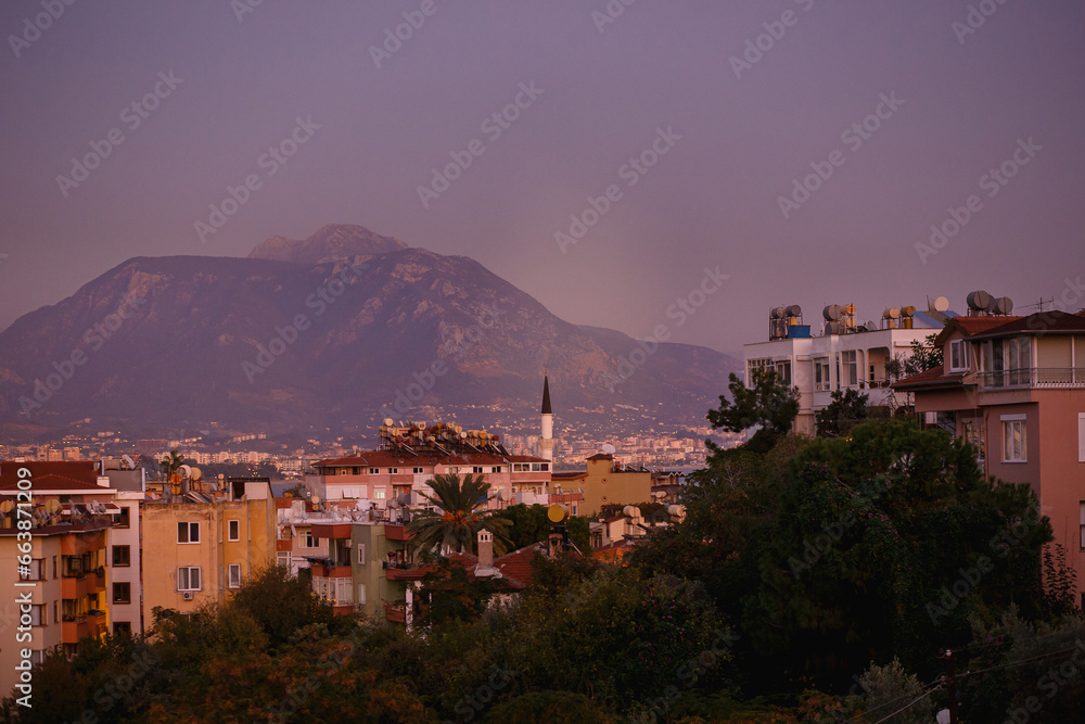 View from the mountains on Alanya, Turkey. Cityscape with sunset over the mountains