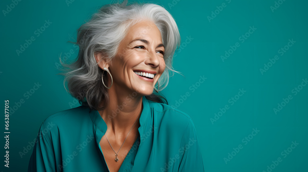 Happy mature woman with gray hair on green background Happy mature woman with gray hair on green background
