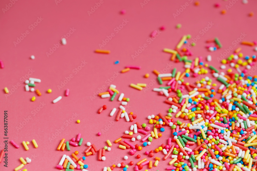 Toppings rainbow for donuts, desserts and ice cream on pink background. Toppings rainbow for donuts, desserts and ice cream on pink background.