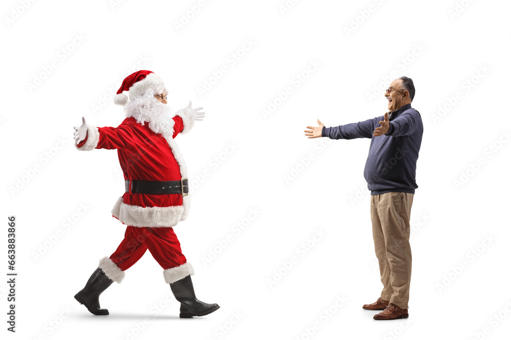 Full length profile shot of a mature man waiting for santa claus with arms whide open Full length profile shot of a mature man waiting for santa claus with arms whide open