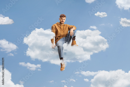 Generation z guy floating on a cloud