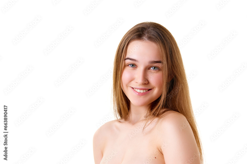 Portrait of charming girl with bare shoulders and shiny, long, brunette hair smiling with teeth looking at camera against white studio background. Portrait of charming girl with bare shoulders and shiny, long, brunette hair smiling with teeth looking at camera against white studio background.