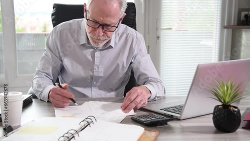 Portrait of an angry businessman working at office