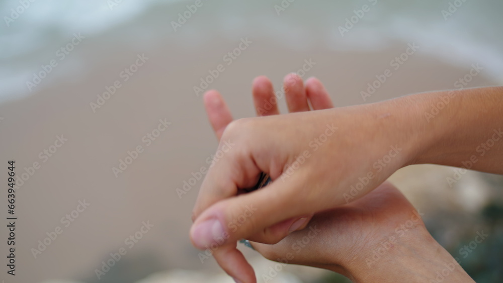 Hands holding sea shell at ocean shore closeup. Holiday vacation memories. Hands holding sea shell at ocean shore closeup. Holiday vacation memories.