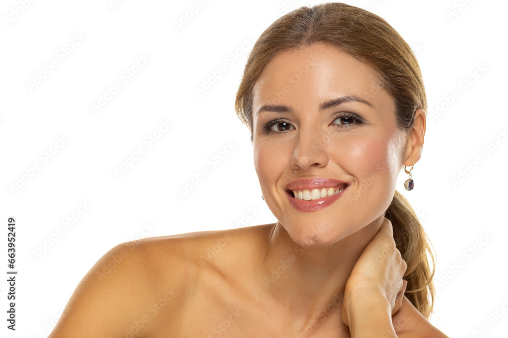 A portrait of a joyful woman with a beautiful smile and tasteful makeup,posing on white studio background, expressing happiness and confidence A portrait of a joyful woman with a beautiful smile and tasteful makeup,posing on white studio background, expressing happiness and confidence