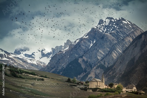 Moody atmosphere landscape view of the Saint-Severin church in Conthey Wallis photo