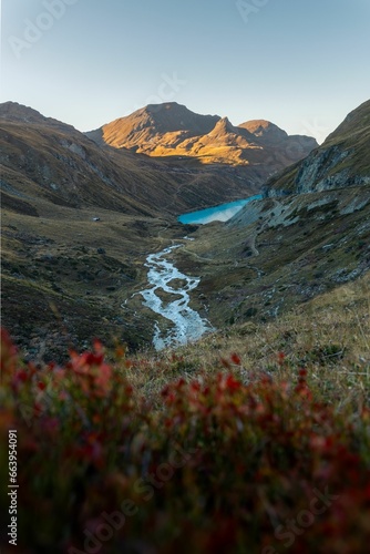 Stream winding through the valley to the Moiry lake photo