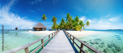 Coconut Palm tree on amazing perfect white sandy beach in island and a bridge to the bungalow. Perfect landscape background for relaxing vacation, island of Maldives. © Santy Hong
