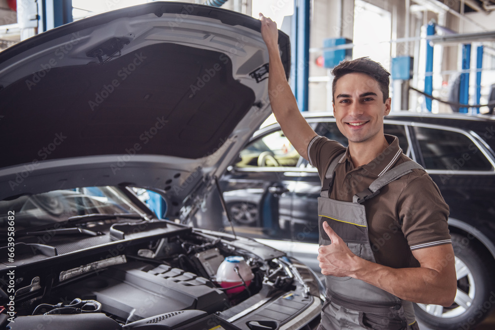 Handsome auto service worker Handsome auto service worker