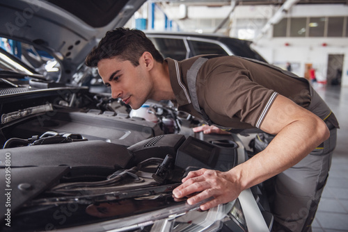 Handsome auto service worker