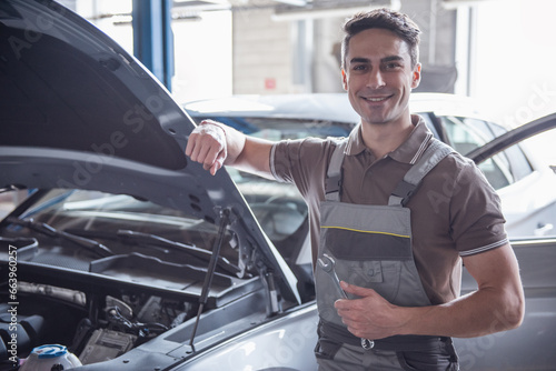 Handsome auto service worker