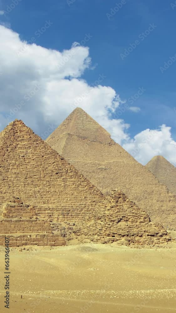 Timelapse with clouds over great pyramids at Giza Cairo in Egypt. Vertical video Timelapse with clouds over great pyramids at Giza Cairo in Egypt. Vertical video