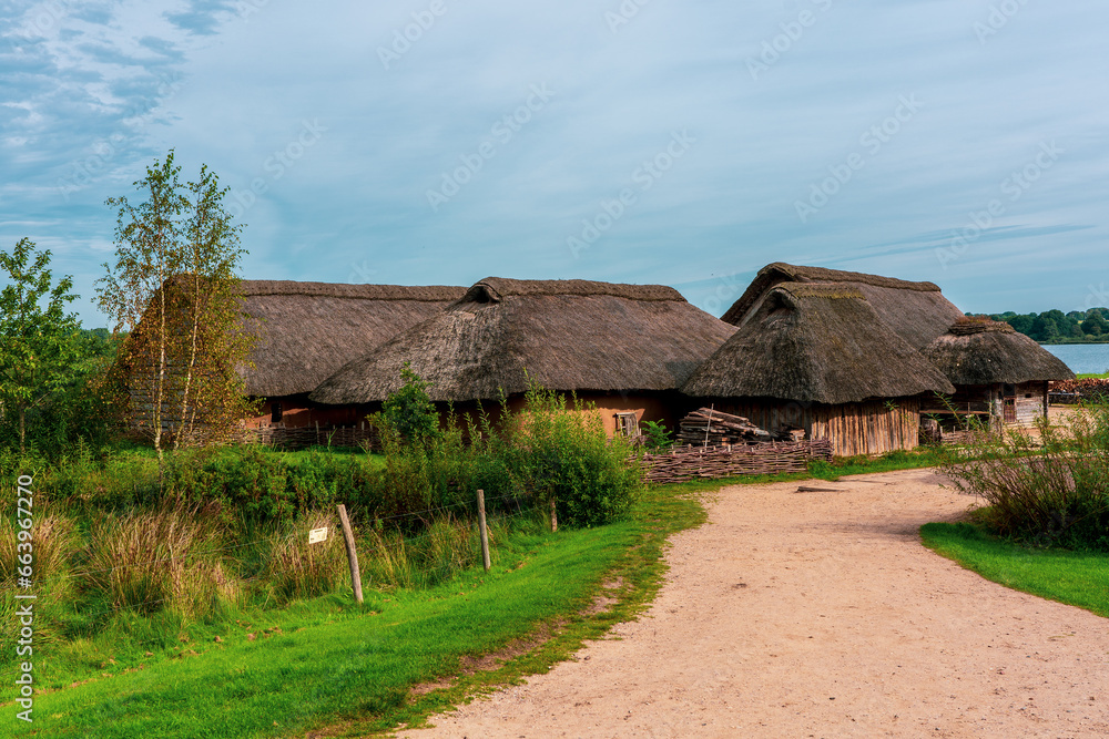 Viking village replica with thatched roof houses. Viking village replica with thatched roof houses.