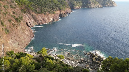 Europe, Italy, Liguria , Framura - drone aerial view of amazing sea landscape in Tigullio national park with pine forest and cliff between Framura Bonassola and Levanto pedestrian path - Cinque Terre  photo