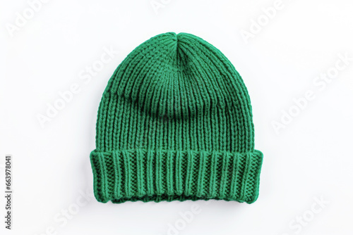 Green knitted warm winter hat isolated on white background