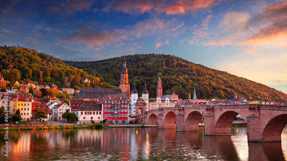 Heidelberg, Germany. Cityscape image of historical city of Heidelberg, Germany with Old Bridge Gate at beautiful autumn sunset.