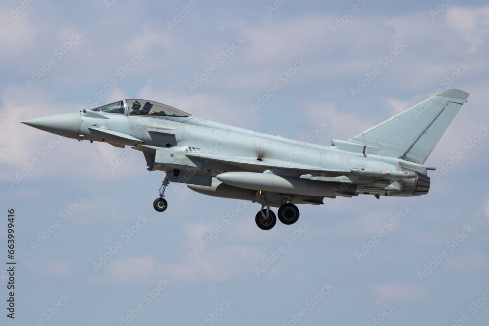 Military fighter jet plane at air base. Airport and airfield. Air force flight operation. Aviation and aircraft. Air defense. Military industry. Fly and flying.