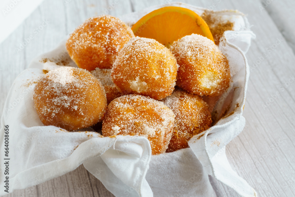 Buñuelos de viento, are balls of dough made with wheat flour, butter and eggs that are fried in hot oil. They are served in the celebrations of All Saints' Day.