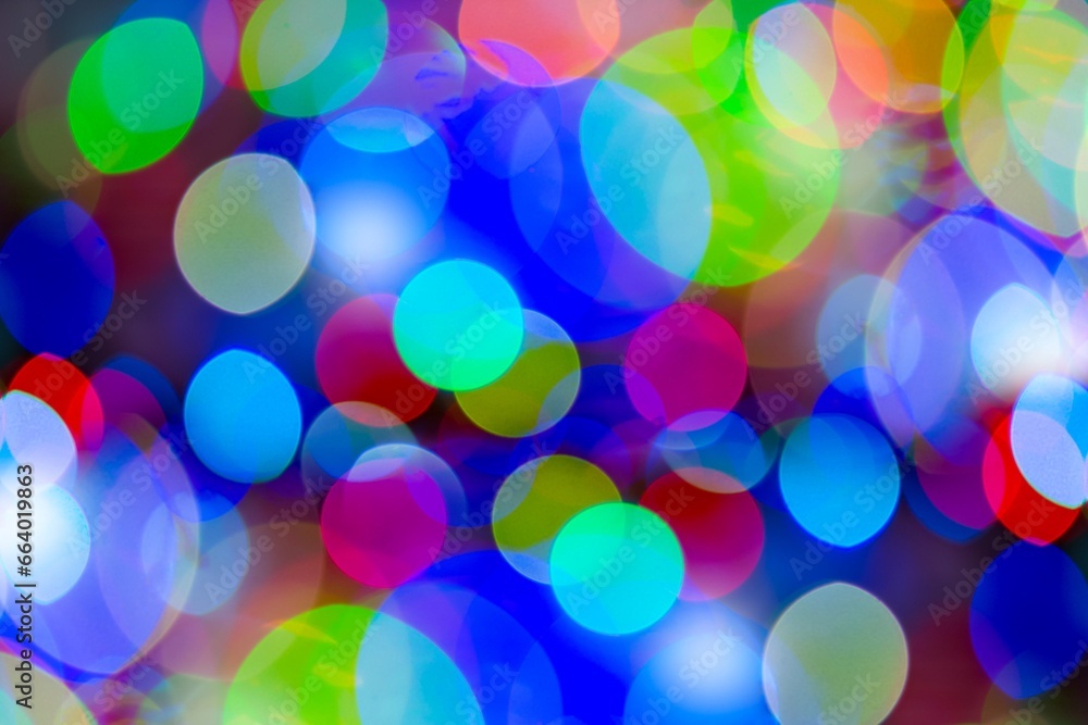 Blurred background with colorful bokeh lights. Background blurred Christmas lights 