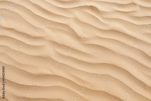 Closeup of sand pattern of a beach in the summer. © ABGoni
