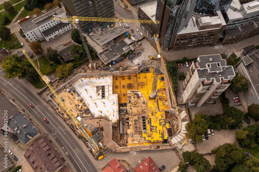 Drone photography of high rise building construction site in the middle of city