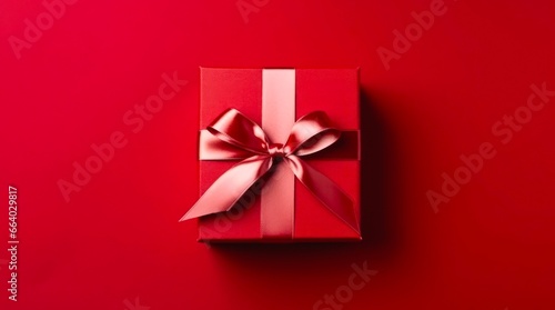 Top view on red gift box on red background. photo