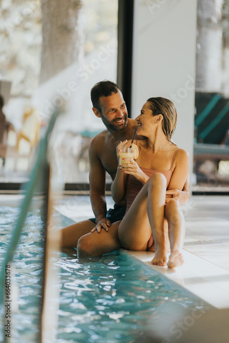 Young couple relaxing by th...