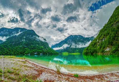 Fototapeta Naklejka Na Ścianę i Meble -  Kings Lake as a water reserve in Berchtesgaden with crystal clear typical green shining water