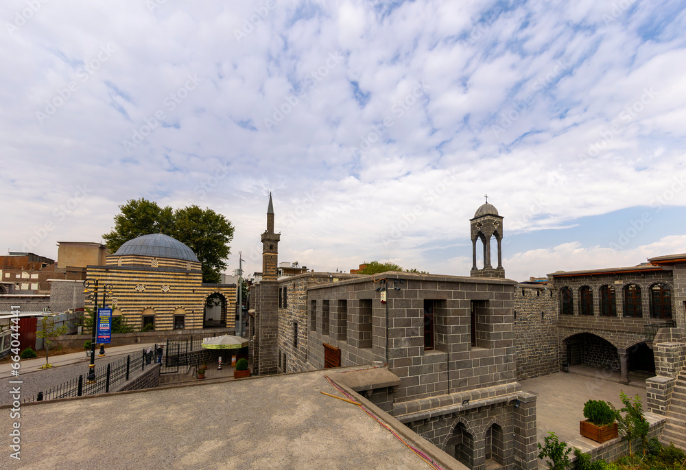Sur, Diyarbakir, Turkey- October 09 2023: Mar Petyun Chaldean Catholic Church located in Sur and Closeup view of unique minaret based on four columns, dubbed the four-legged Minaret in Diyarbakir