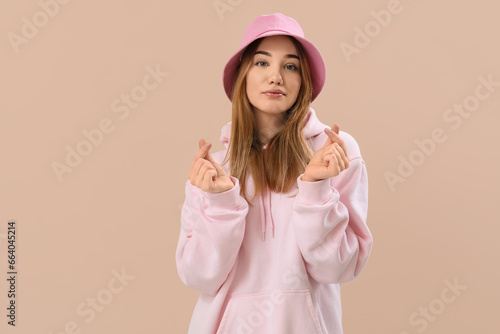 Young woman making heart wi...