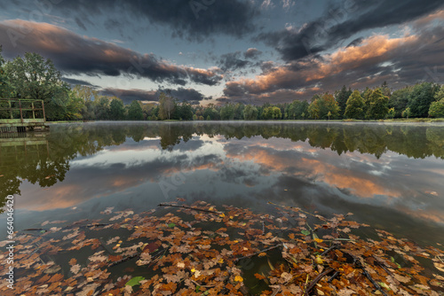 Stromovka park with trees forest and pond Bagr in autumn morning photo
