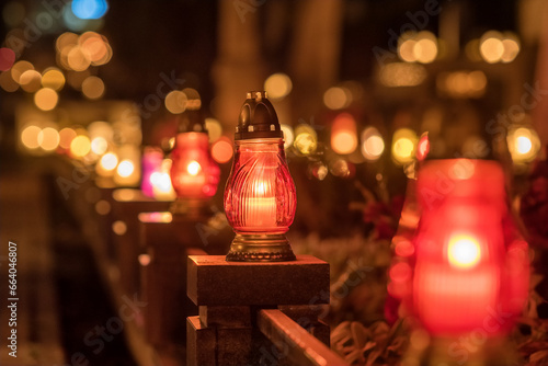 Candle lights at the cemetery at night in Poland during All Saints Day