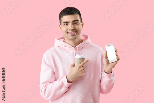 Young man with smartphone a...