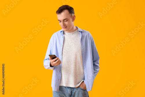 Young man with mobile phone...