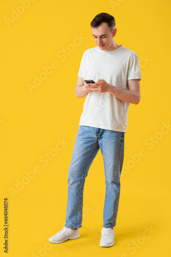 Young man with mobile phone...