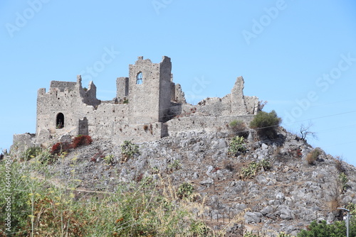 A glimpse of the ruins of the mausoleum of Tredoliche. landscape from the uins of Cirella, an abandoned village for a century in the Calabria region in Italy photo