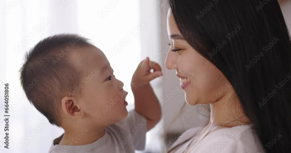 Mother and son face to face. Chinese, Japanese, Korean. Adorable infant baby boy son playing with Asian mom at home. Happy family learning funny game having fun enjoying sweet moments together Mother and son face to face. Chinese, Japanese, Korean. Adorable infant baby boy son playing with Asian mom at home. Happy family learning funny game having fun enjoying sweet moments together